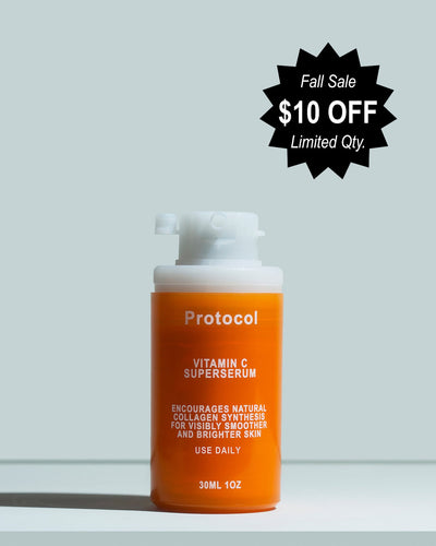 Orange serum bottle with white pump labeled 'Protocol' on a light gray background with a black sale label.