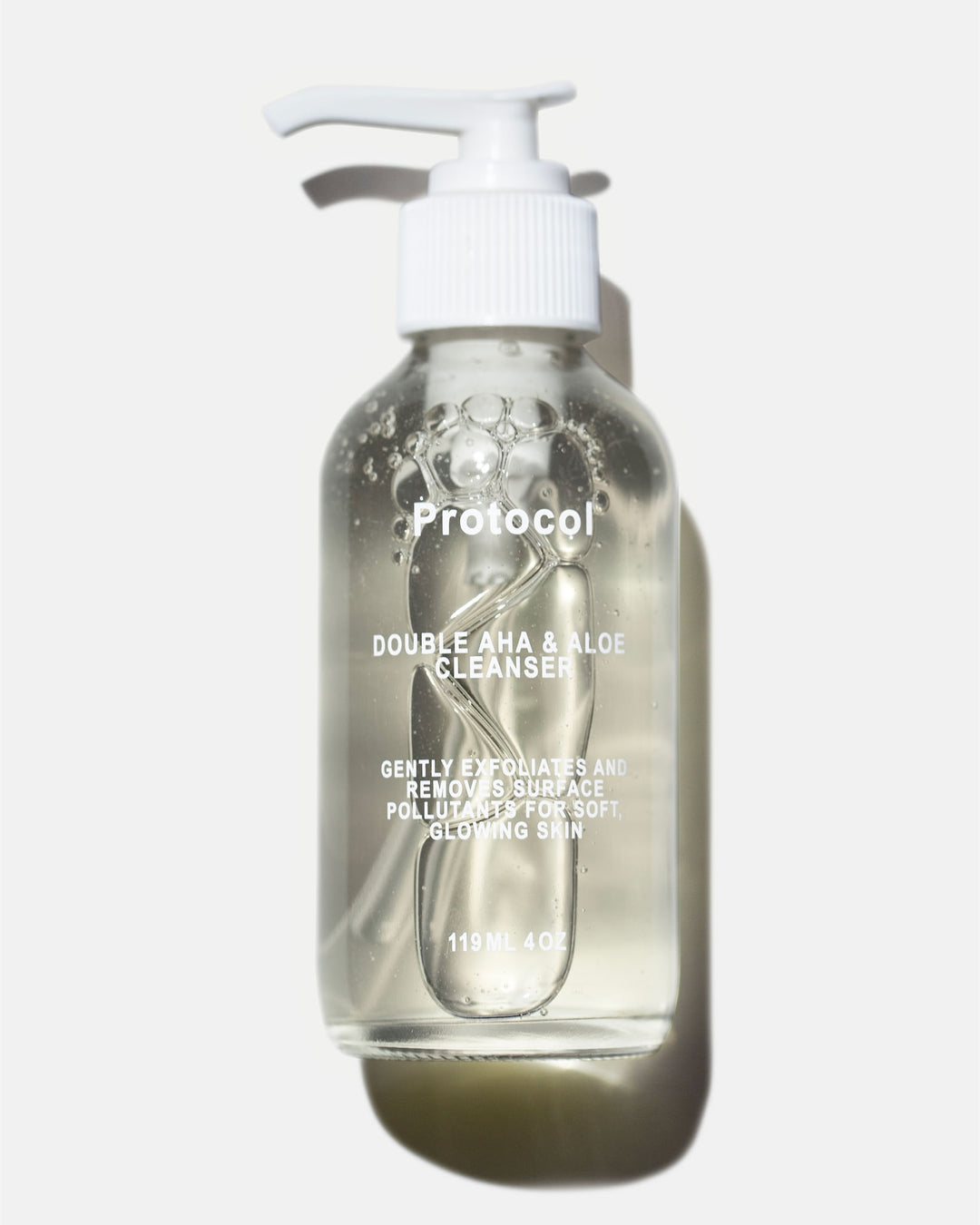 clear glass cleanser bottle