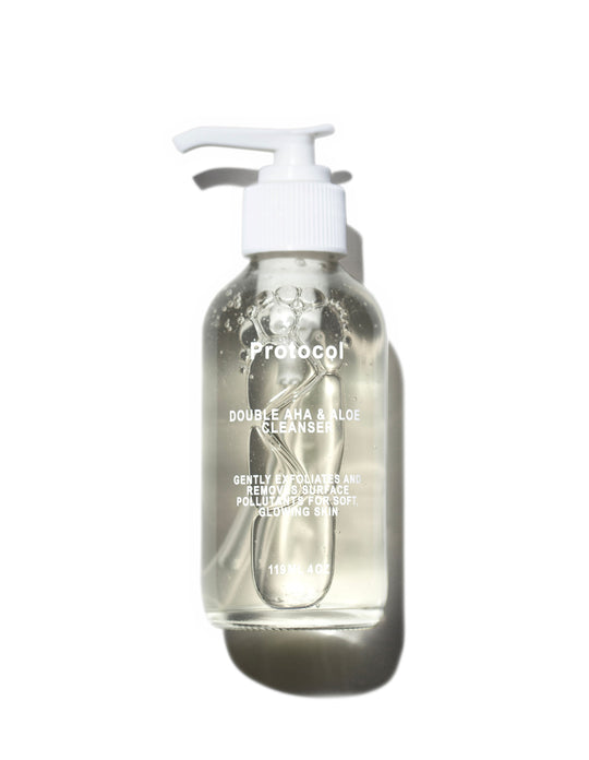 A clear pump bottle of Protocol Double AHA &amp; Aloe Cleanser filled with a transparent liquid, set against a solid white background with a soft shadow.
